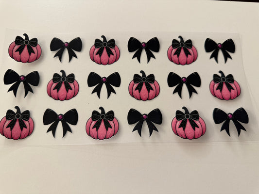Pink pumpkins black bows